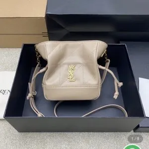 Saint Laurent Jamie mini shoulder pouch in beige lambskin leather.
