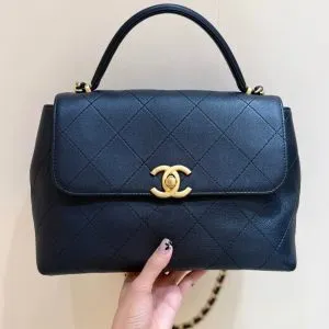 CHANEL Maxi Flap Bag with Top Handle